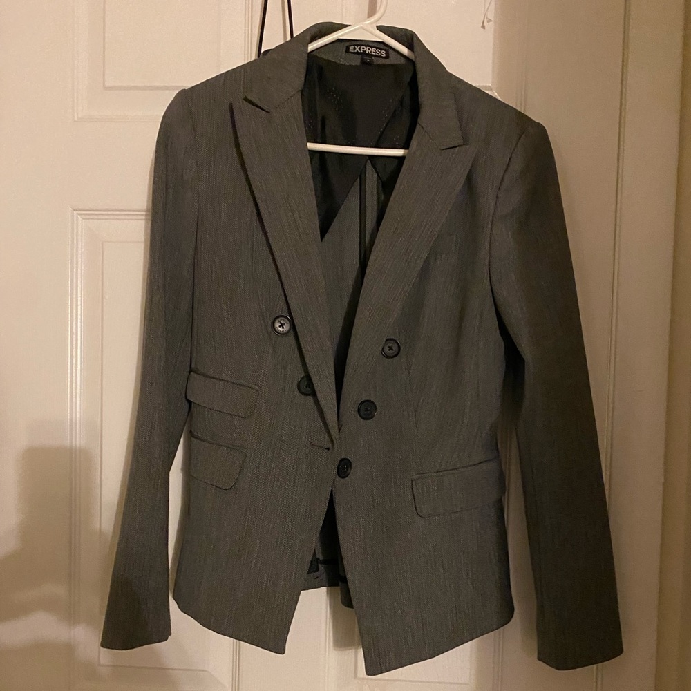 Blazer color gray with black buttons. Size 6 .
